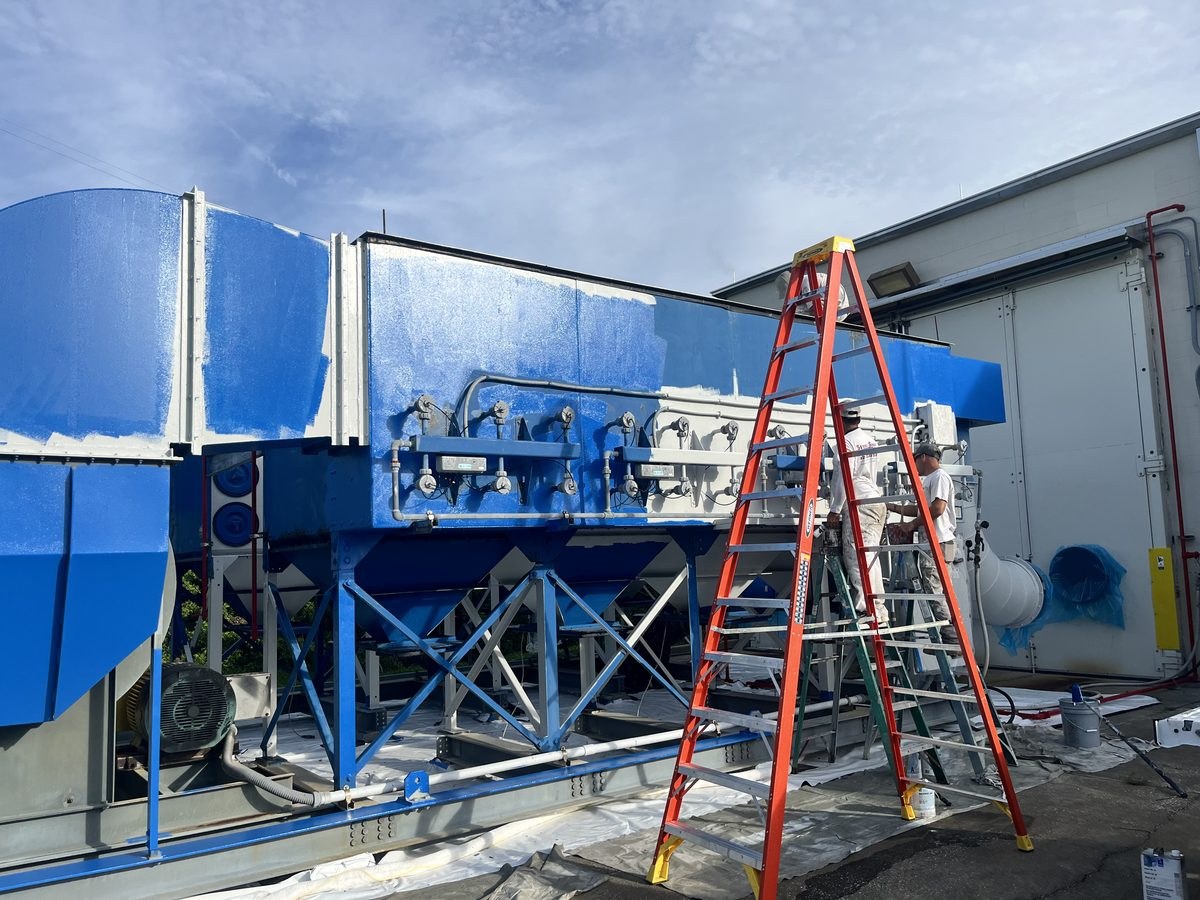 Industrial machinery coating in progress